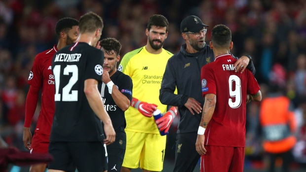 Juergen Klopp hugs Liverpool's Roberto Firmino