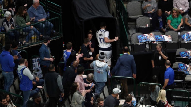 Mavs' Doncic injures ankle in Heat game, ruled out