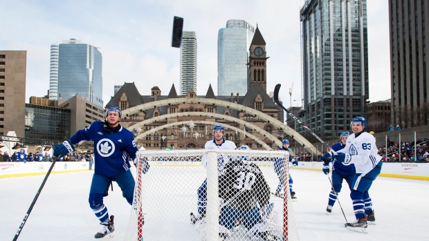 Leafs players watch the puck sail over the net Thursday at Nathan Phillips Square.