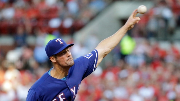 Hamels pitches Rangers to 1-0 win over Cardinals