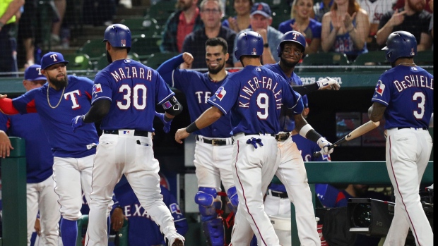 24 MAY 2016: Texas Rangers right fielder Nomar Mazara #30 gets  congratulated by Adrian Beltre after hitting a home run during the MLB game  between the Los Angeles Angels and Texas Rangers