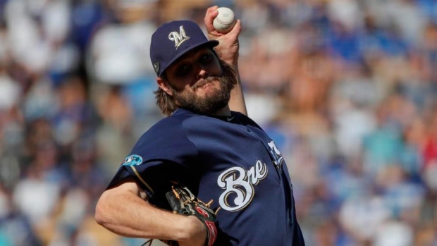 Brandon Woodruff pitches seven scoreless innings to lift NL