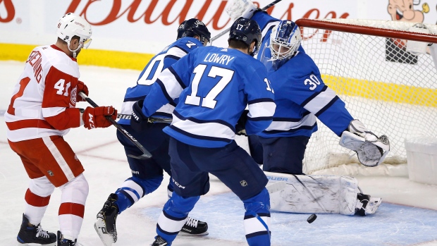 Connor Hellebuyck stops 33 shots, Jets beat Red Wings 3-0