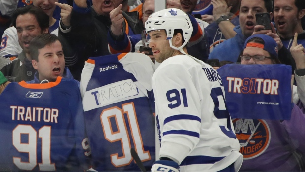 Fans throw fake snakes, call new Leafs player John Tavares a