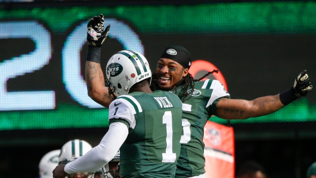 New York Jets Michael Vick celebrates with Calvin Pryor after