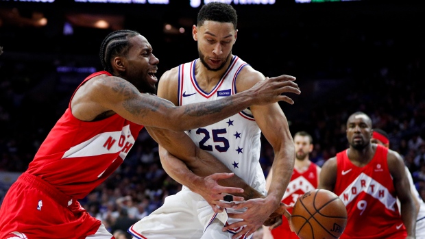 Kawhi Leonard battles Ben Simmons Thursday night.