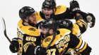 Patrice Bergeron is congratulated by his teammates Thursday.