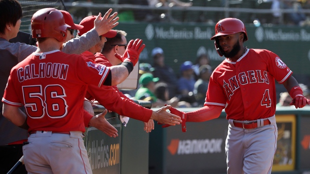 Kole Calhoun's triple in 11th send Angels to 11-9 victory against A's