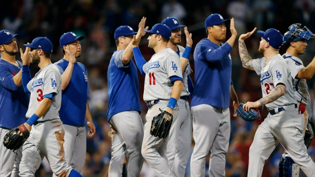 Boston Red Sox Brock Holt tags out Los Angeles Dodgers' Cody