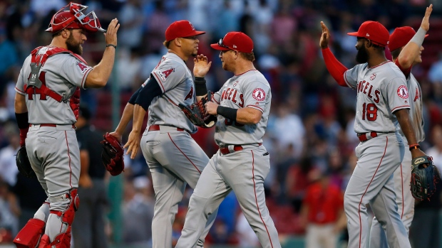 Kole Calhoun scores on wild pitch to push Angels past Mariners in 10 innings