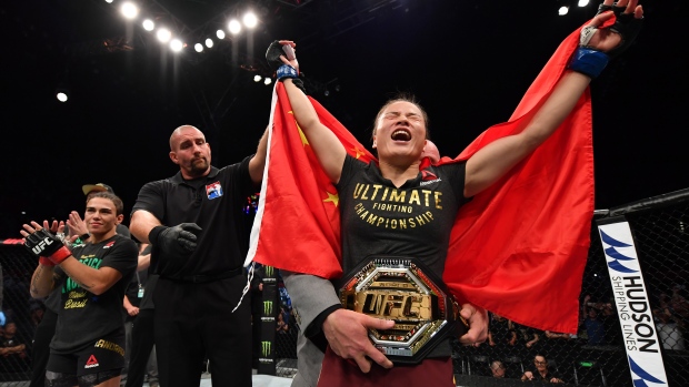 Zhang Weili of China celebrates after her victory over Jessica Andrade 