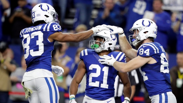 Indianapolis Colts running back Jordan Wilkins (20) runs the ball against  the Tennessee Titans …