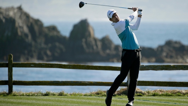 Nick Taylor follows his drive Friday in Pebble Beach, Calif.