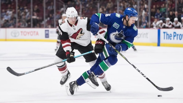 Canucks call up two defencemen from AHL, reassign forward to Utica