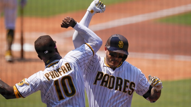 Machado's 2 home runs carry the Padres to a 4-2 win against the Cardinals, World