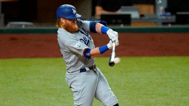 Justin Turner celebrates with Dodgers on field after positive COVID test
