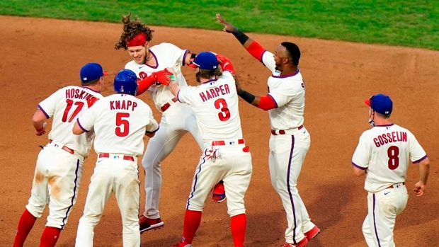 Late rallies lift Phils to win in first of doubleheader