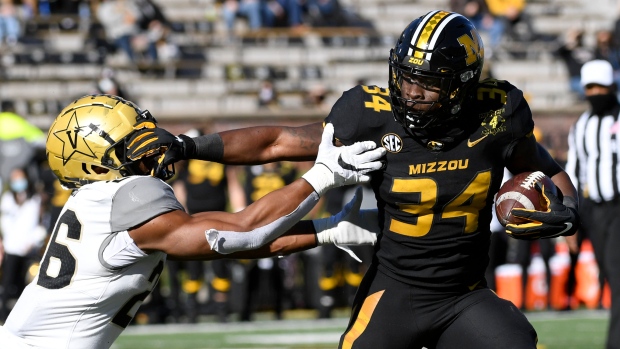 Missouri running back Larry Rountree III and Vanderbilt linebacker Anfernee Orji 