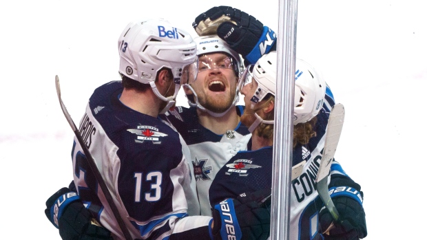 Pierre-Luc Dubois celebrates game winning goal with teammates 