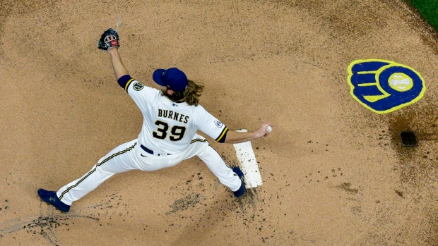 Corbin Burnes delivers with arm, bat as Brewers trounce Cubs