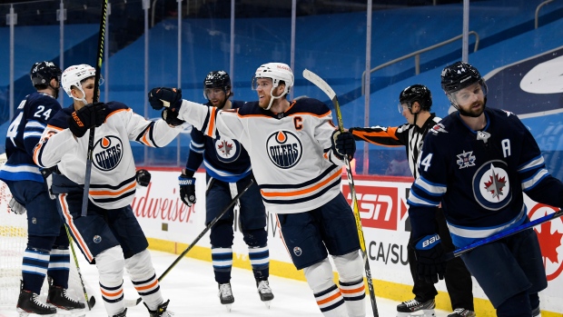 Connor McDavid and Jesse Puljujarvi celebrate