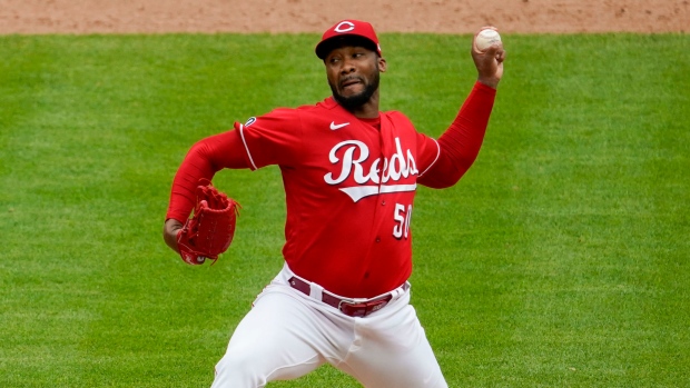 Amir Garrett leaves game with hand injury