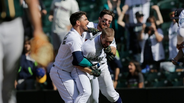 Mariners rally late, post five-run 10th to sink Athletics