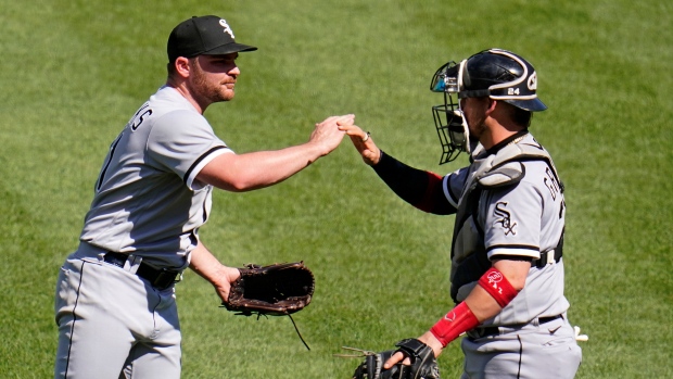 Chicago White Sox catcher Yasmani Grandal (24) swings at the pitch