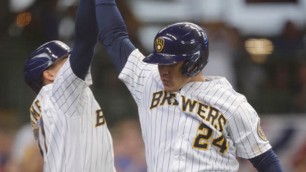 Images from the Milwaukee Brewers' 7-6 win over the Colorado Rockies