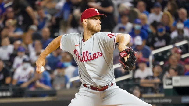 Philadelphia Phillies' Didi Gregorius, left, and Zack Wheeler put