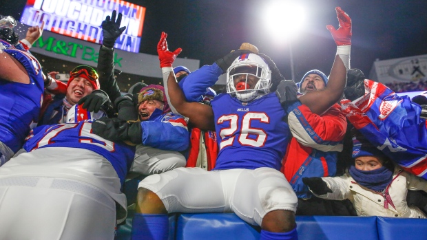 Buffalo Bills running back Devin Singletary (26) runs with the ball during  the first half of an NFL football game against the Pittsburgh Steelers in  Orchard Park, N.Y., Sunday, Oct. 9, 2022. (