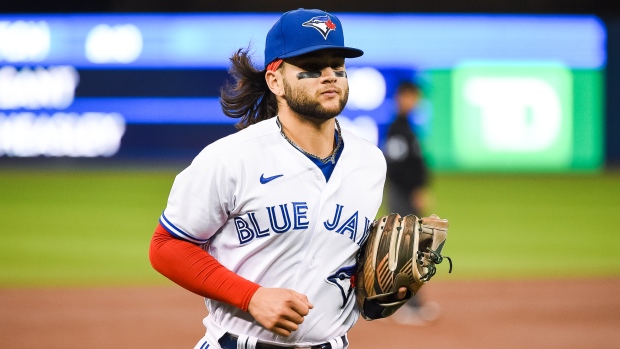 FILE - Toronto Blue Jays' Bo Bichette rounds the bases after