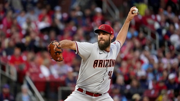 Arizona's Madison Bumgarner held back by teammates after first