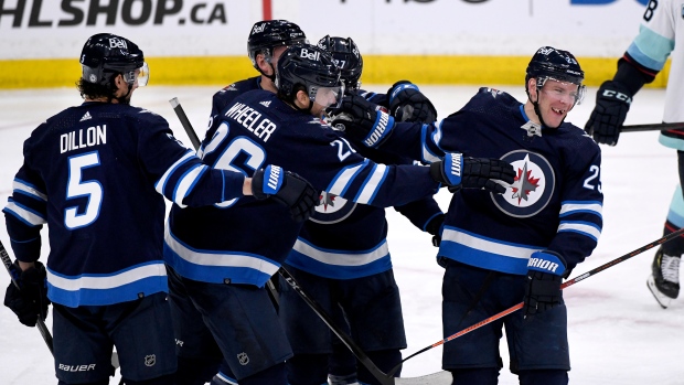 The Winnipeg Jets celebrate a goal during the game between the