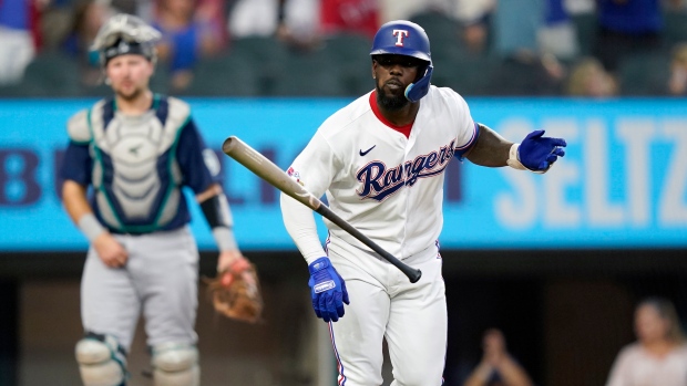Rangers slugger Adolis García, leading the AL in RBIs, exits game after  getting hit by a pitch - The San Diego Union-Tribune