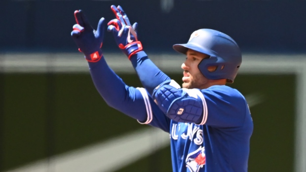 Toronto, Canada. 20th May, 2022. Toronto Blue Jays' George Springer hits an  RBI single, scoring Bradley Zimmer, not shown, in the fifth inning of an  Interleague League baseball game against the Cincinnati