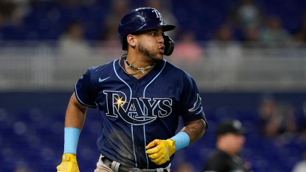 Tampa Bay Rays' Jose Siri heads for first base after hitting a