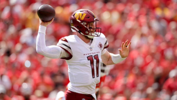 Carson Wentz works out in gear from his three teams, while waiting