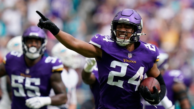 Minnesota Vikings safety Camryn Bynum (24) defends Miami Dolphins wide  receiver Tyreek Hill (10) during the