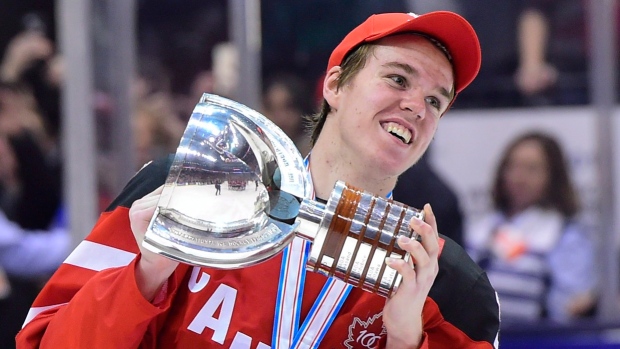 connor-mcdavid-with-world-junior-trophy.jpg