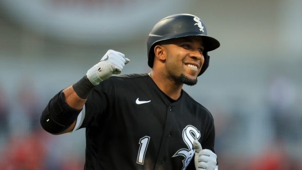 Chicago White Sox's Elvis Andrus, left, puts on the home run Southside  jacket and hat on Luis Robert Jr., right, after Robert hit a solo home run  against the Los Angeles Dodgers