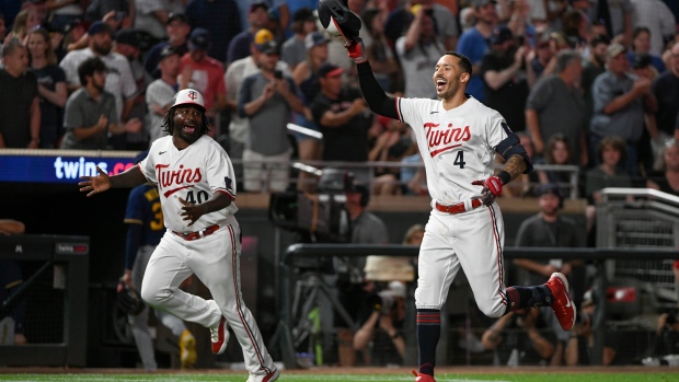 LOS ANGELES, CA - MAY 16: Minnesota Twins shortstop Carlos Correa (4) jogs  off the field between innings during a regular season game between the  Minnesota Twins and Los Angeles Dodgers on