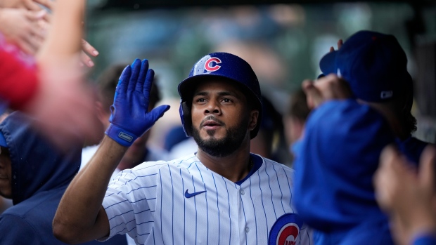 Swanson and Candelario go deep as the Cubs hold off the Braves 8-6