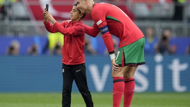 UEFA fines its Euro 2024 co-organizer Germany over selfie-seekers on field with Cristiano Ronaldo Article Image 0