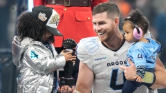 Nick Arbuckle with his two daughters after Grey Cup victory