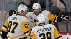 Bryan Rust, Sidney Crosby, and Marcus Pettersson