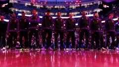 Toronto Raptors players stand for anthem