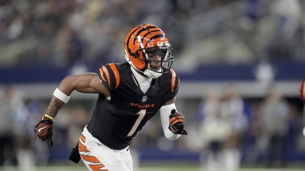 Chase, Higgins reach extensions with Bengals. AP source says Chase will be NFL's highest-paid non-QB Article Image 0