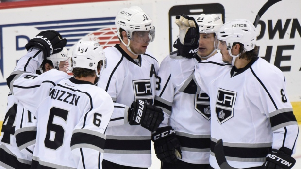 Anze Kopitar and Matt Greene of the Los Angeles Kings react after the