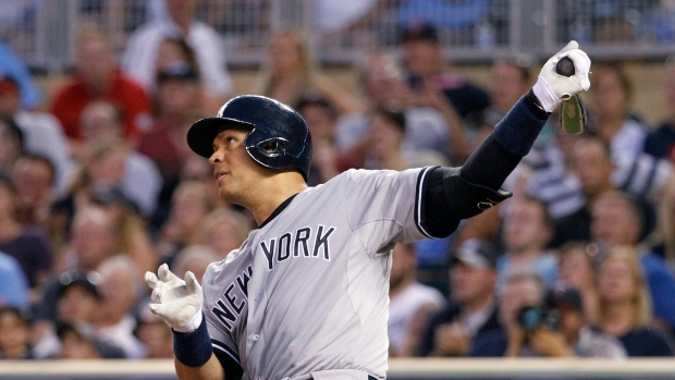 Alex Rodriguez of the New York Yankees hits a three run home run